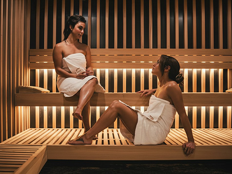 Commercial sauna lounge area with SaunaCloud units