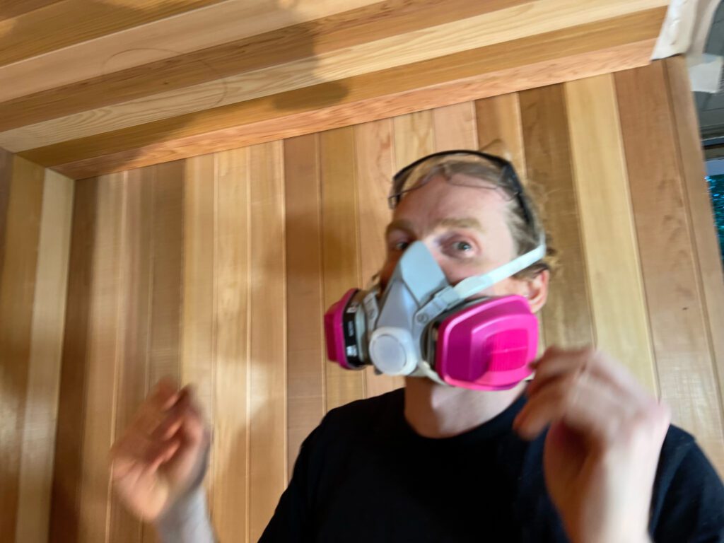 Allan precision-fitting cedar panels for a custom sauna